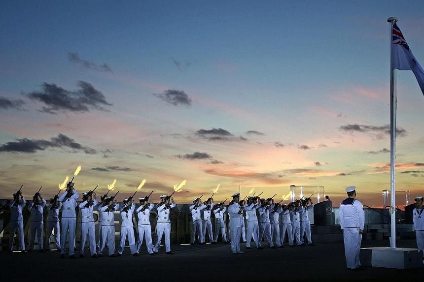 Crew of the Royal Australian Navy ship HMAS Stirling participate in dawn commemorations marking 100 years since the first ANZAC (Australian and New Zealand Army Corp) troops departed for Turkey and the Western Front in World War I at Anzac Peace Park