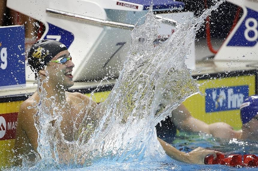 South Africa's Chad Le Clos reacts after winning the men's 50m butterfly event in the Fina/Mastbank Swimming World Cup at the OCBC Aquatic Centre on Saturday, Nov 1, 2014. -- ST PHOTO: KEVIN LIM