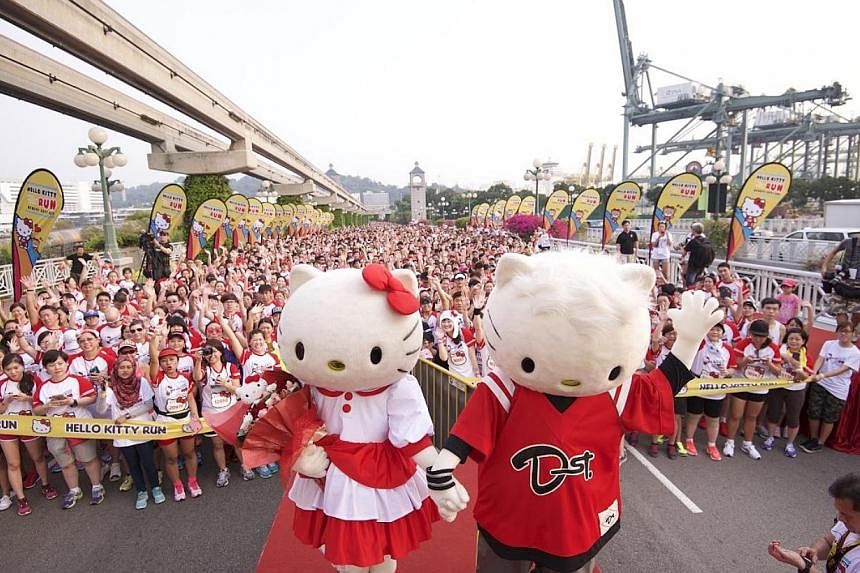 The world's most beloved mouthless feline, Hello Kitty, celebrated her 40th birthday Saturday morning - with more than 17,000 race participants turning up for the inaugural Hello Kitty Run Singapore held in Sentosa. -- PHOTO: PINK APPLE