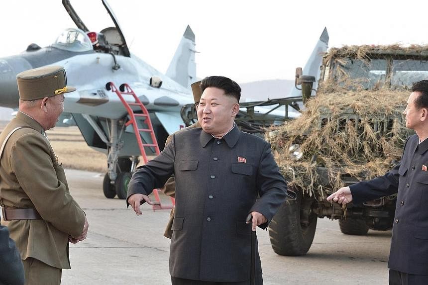 North Korean leader Kim Jong Un guides a flight drill for the inspection of airmen of the Korean People's Army (KPA) Air and Anti-Air Force in this undated photo released by North Korea's Korean Central News Agency (KCNA) in Pyongyang on Oct 30, 2014