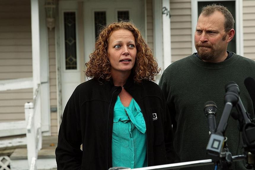 Kaci Hickox stands with her boyfriend Theodore Michael Wilbur as she gives a statement to the media in front of her home in Fort Kent, Maine&nbsp;on Oct 31, 2014. -- PHOTO: AFP
