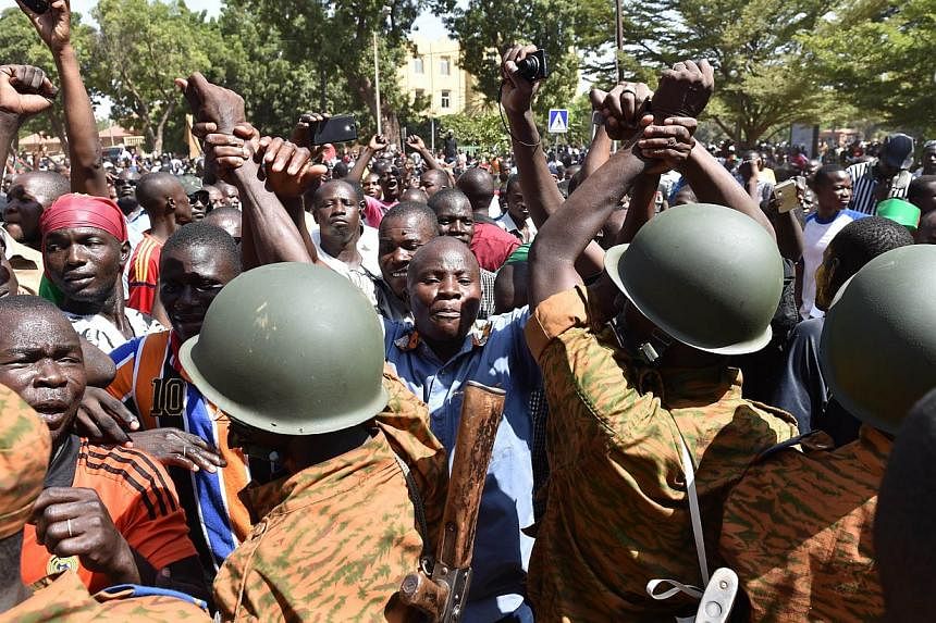 A crowd gathers on Oct 31, 2014 in front of army headquarters in Ouagadougou, demanding that the army take over following the resignation of the president.&nbsp;A group of Burkina Faso army officers claimed on Friday to have "taken the destiny of the
