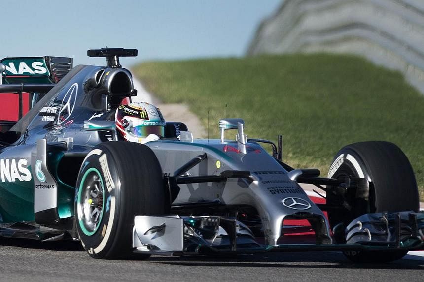 British driver Lewis Hamilton of Mercedes AMG Petronas takes a turn during the first practice session for the United States Formula One Grand Prix at the Circuit of the Americas track in Austin, Texas, Oct 31, 2014. -- PHOTO: AFP&nbsp;