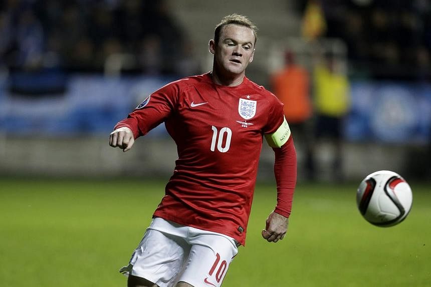 Wayne Rooney in action for England during a Euro 2016 qualifying match against Estonia on Oct 12, 2014. Manchester United captain Rooney has been passed fit for the Manchester derby on Sunday, manager Louis van Gaal said on Friday. -- PHOTO:&nbsp; RE