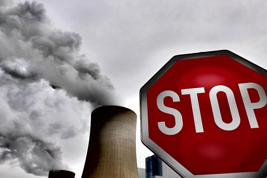 Governments can keep climate change in check at manageable costs but will have to cut greenhouse gas emissions to zero by 2100 to limit fast-worsening risks, a UN report showed on Sunday. -- PHOTO: AFP