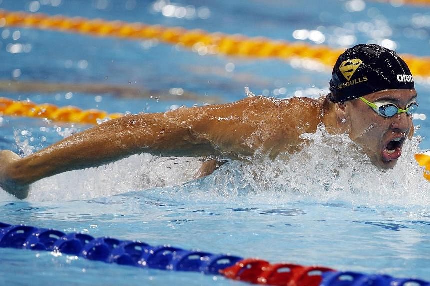 Chad Le Clos of South Africa swims to win the men's 100m butterfly event of the FINA Swimming World Cup at the Aquatic Centre in Singapore on Nov 2, 2014. The South African swimming ace made it an incredible 27 wins in 27 races at the series. -- PHOT