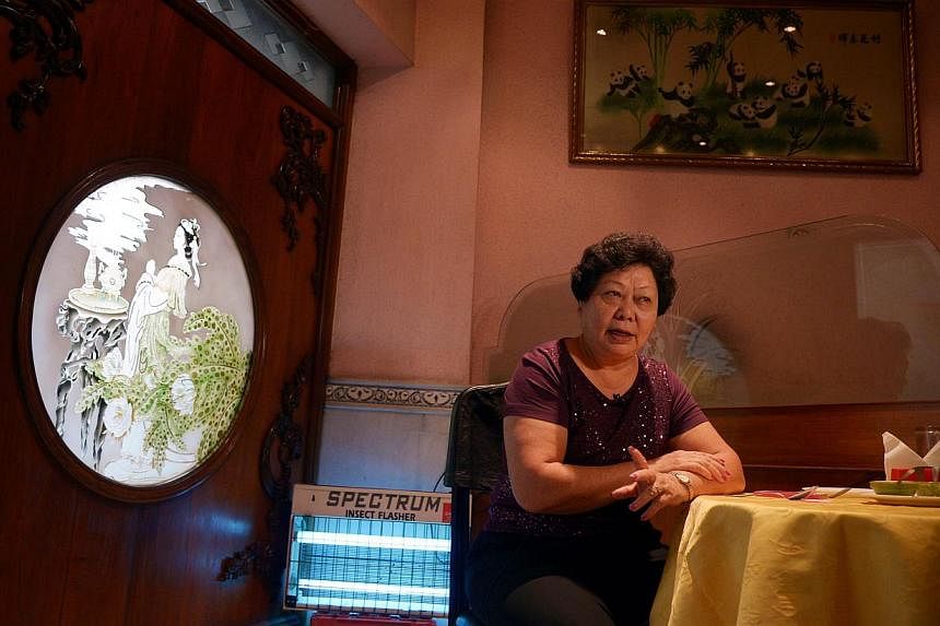 Businesswoman Monica Liu, a member of India's Chinese community, speaks during an interview at her restaurant in Kolkata on Oct 14, 2014. -- PHOTO: AFP
