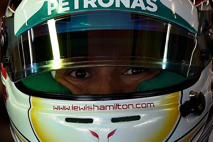 Mercedes AMG Petronas driver Lewis Hamilton of Britain arrives in the pits before posting the fastest time during the final practice session of the United States Formula One Grand Prix at the Circuit of The Americas in Austin, Texas on Nov 1, 2014. -