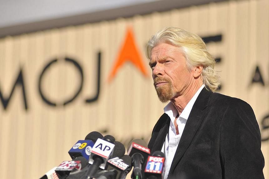 Virgin founder Richard Branson speaks at a press conference at the Mojave Air and Space Port in Mohave, California on Nov 1, 2014. Branson insisted on Saturday that his dream of commercial space travel remained alive but warned his company would not 
