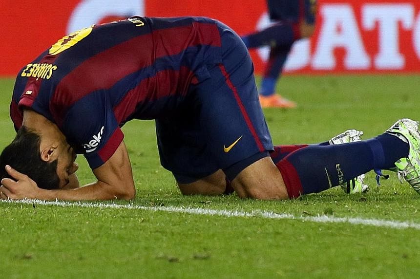 Barcelona's Luis Suarez reacts after missing a goal against Celta Vigo during their Spanish first division soccer match at Camp Nou stadium in Barcelona on Nov 1, 2014. -- PHOTO: REUTERS