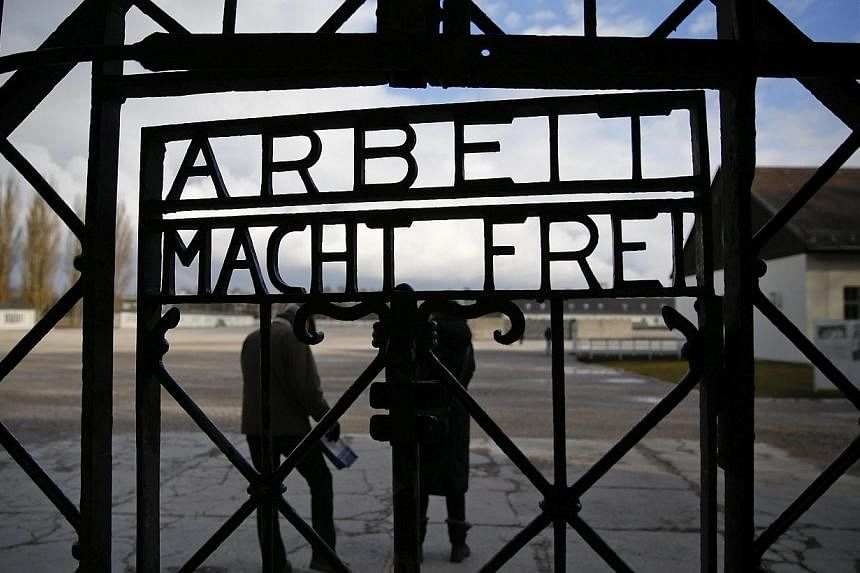 The main gate of the former Dachau concentration camp with the sign "Arbeit macht frei" (work sets you free) is seen in Dachau, near Munich, in this Jan 25, 2014 file picture. -- PHOTO: REUTERS