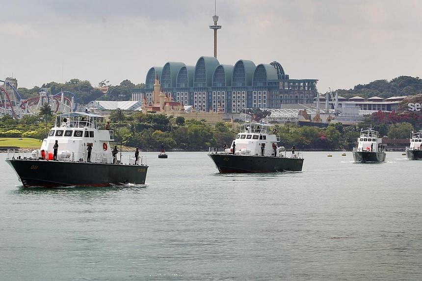 Coast Guard ships sailing just off the shore of Sentosa Island.&nbsp;A new law to combat &nbsp; human trafficking, which &nbsp;Members of Parliament called &nbsp;historic, was passed on Monday but not before a &nbsp;2½ hour debate on whether it went