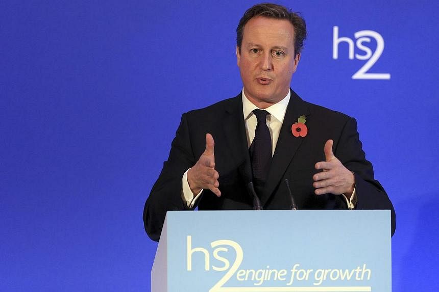 Britain's Prime Minister David Cameron speaks on high speed rail link HS2, at the launch of the HS2 report, in Leeds Civic Hall, northern England on Oct 27, 2014.&nbsp;-- PHOTO: REUTERS