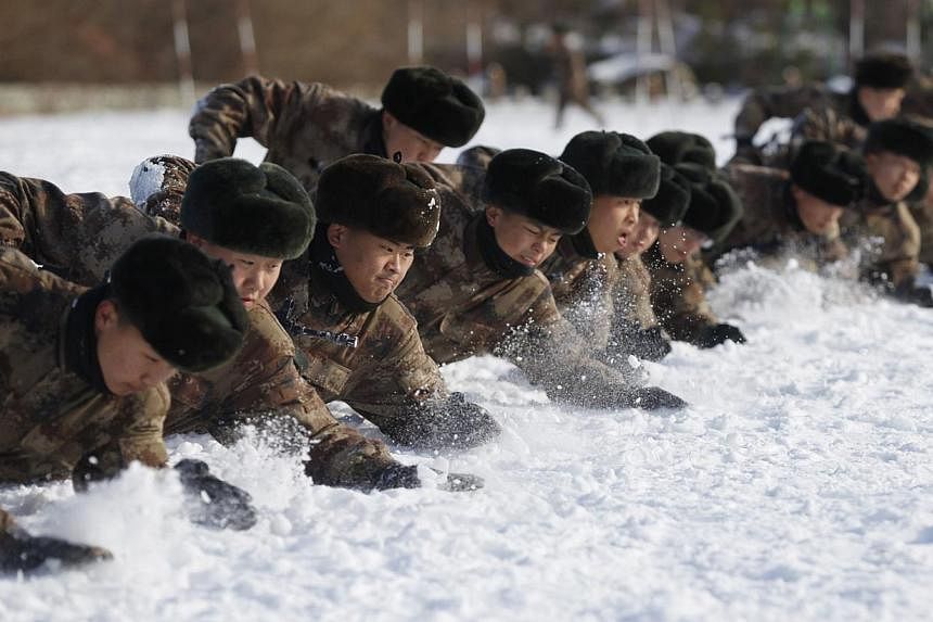 China's People's Liberation Army&nbsp;soldiers training in the snow at their camp in Heihe, north-east China's Heilongjiang province on Oct 29, 2014.&nbsp;Anyone calling for the PLA to be loyal to the state rather than the Communist party has a "very