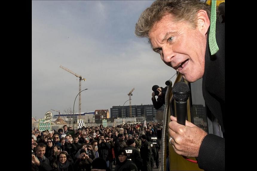 American actor David Hasselhoff speaking to the crowd as he tours the remains of the former Berlin Wall. -- PHOTO: AGENCE FRANCE-PRESSE