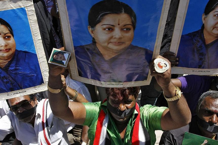 Supporters of convicted political leader Jayalalithaa Jayaram protesting against the court verdict finding her guilty of corruption on Sept 27.