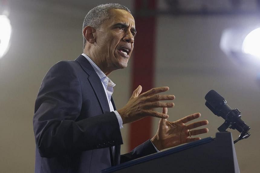 US President Barack Obama talks at a campaign event for the re-election of Connecticut Governor Dan Malloy while at Central High School in Bridgeport, Connecticut, on Nov 2, 2014. -- PHOTO: REUTERS