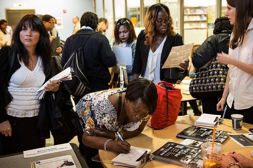 A jobs fair at the Bronx Public Library on Sept 17, 2014, in the Bronx Borough of New York City. -- PHOTO: AFP