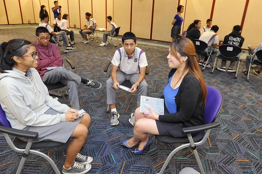 A staff member from the Changi Airport Group role-plays with NorthLight School students during the Interview Skills Workshop &nbsp;on July 16, 2014. -- PHOTO: ST FILE
