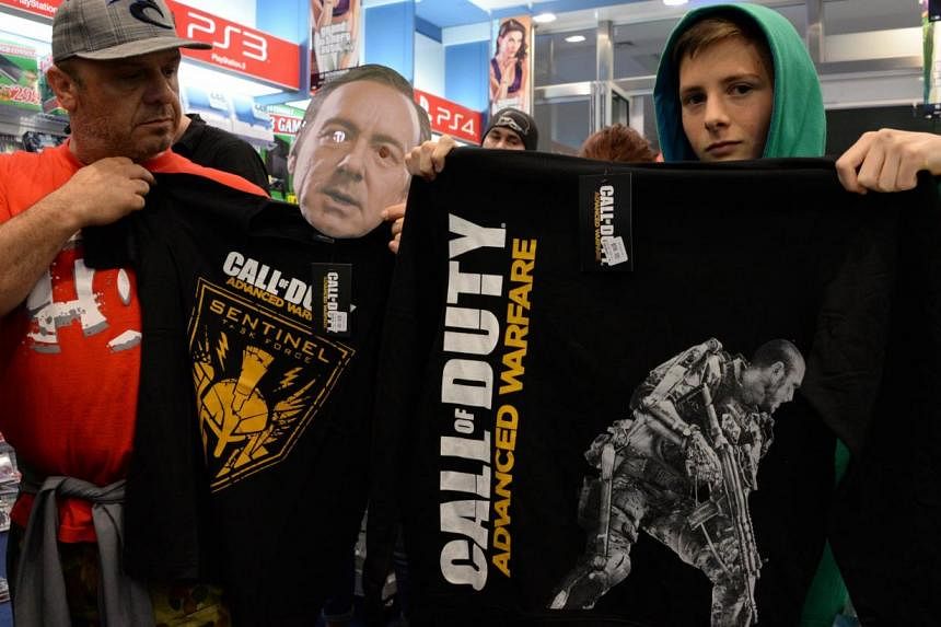 Call of Duty fans show off their T-shirts -- PHOTO: AFP