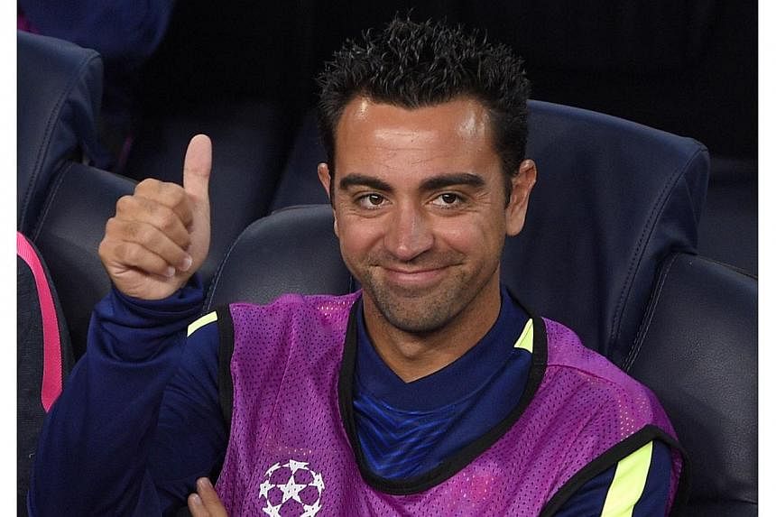 Barcelona's midfielder Xavi Hernandez gestures before the UEFA Champions League football match FC Barcelona vs Ajax Amsterdam at the Camp Nou stadium in Barcelona on Oct 21, 2014.&nbsp;FC Tokyo are eyeing an ambitious swoop on the Barcelona and Spain
