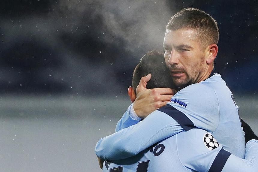 Manchester City's Sergio Aguero (left) is congratulated by teammate Aleksandar Kolarov after scoring a goal during their Champions League Group E soccer match against CSKA Moscow at the Arena Khimki outside Moscow, on Oct 21, 2014.&nbsp;Manchester Ci
