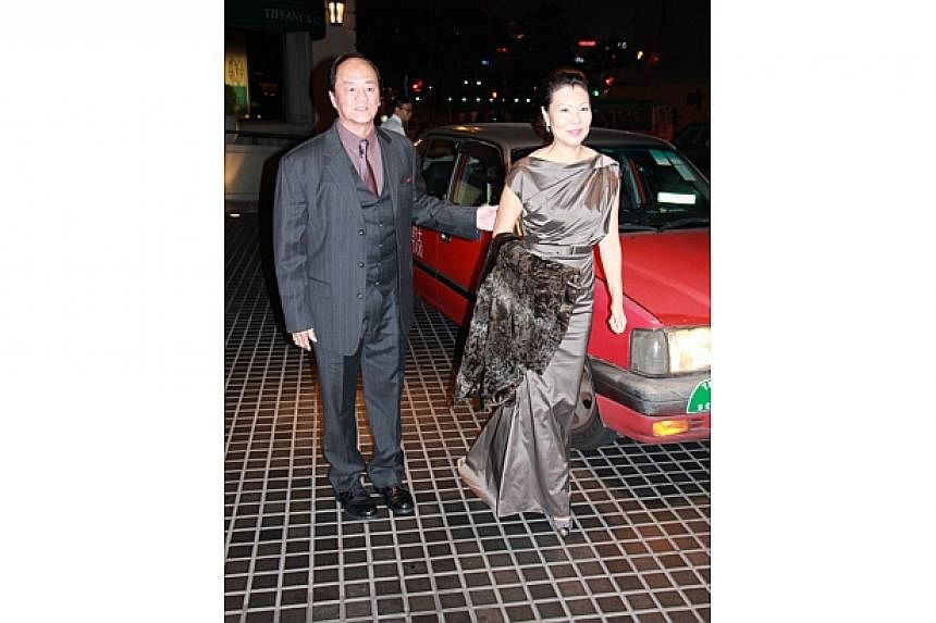 Ti Lung and his wife Tao Ming-min arrive at the party.&nbsp;-- PHOTO: APPLE DAILY