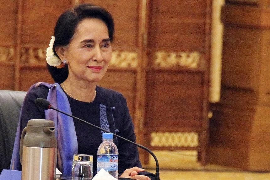 Myanmar opposition leader and Nobel Prize-winner Aung San Suu Kyi will pay an official visit to China next month, an official from her party said on Tuesday. -- PHOTO: REUTERS