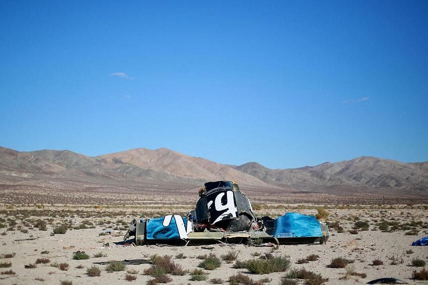 Debris from Virgin Galactic SpaceShip 2 sits in a desert field north of the Mojave in California. A prematurely deployed slowing device could "well be" behind the Virgin Galactic spaceship crash, says Virgin's boss Richard Branson. -- PHOTO: AFP