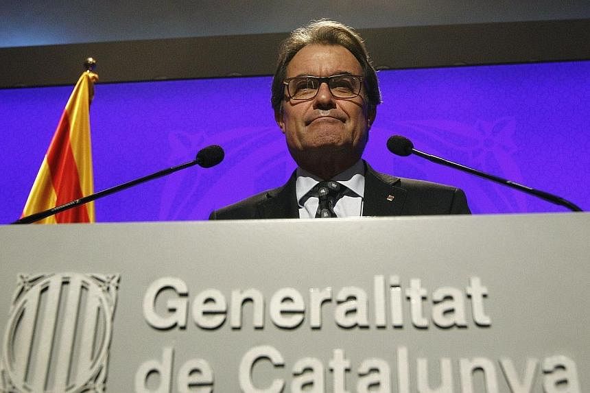 Catalonia's leader vowed Wednesday that a symbolic independence vote banned by the Spanish government will go ahead on November 9, setting the stage for a constitutional conflict unprecedented in post-Franco Spain. -- PHOTO: AFP