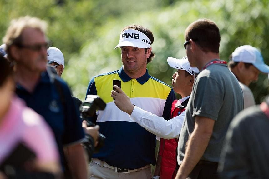 Bubba Watson of the US (centre) and a fan takes a selfie during the Pro-Am event for the WGC-HSBC Champions golf tournament in Shanghai on Nov 5, 2014.&nbsp;Double US Masters champion Bubba Watson turned 36 on Wednesday and said he needs to turn over