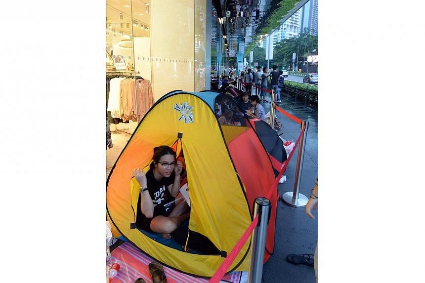 People eager to get their hands on the Alexander Wang x H and M collaboration have begun queuing today afternoon at Orchard before doors open for sale at 8am on Thursday. -- ST PHOTO:&nbsp;AZIZ HUSSIN