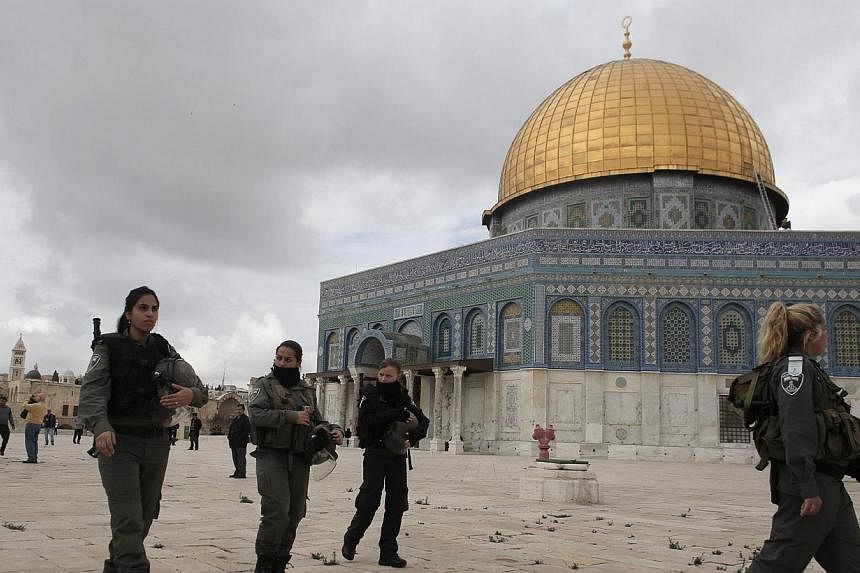Israeli security forces walk near Jerusalem's Dome of the Rock mosque in the Al-Aqsa mosque compound, the third holiest site in Islam but also the most sacred place in Judaism on Nov 5, 2014.&nbsp;Jordan on Wednesday recalled its ambassador to Israel