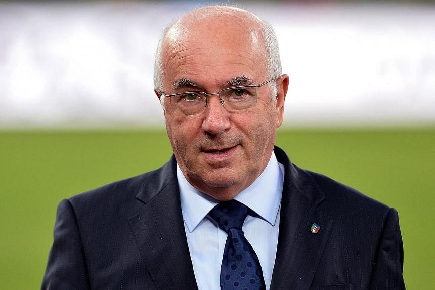 Italian football federation (FIGC) president Carlo Tavecchio has been barred from holding any position with world governing body Fifa for six months over an alleged racist comment he made in August. -- PHOTO: AFP