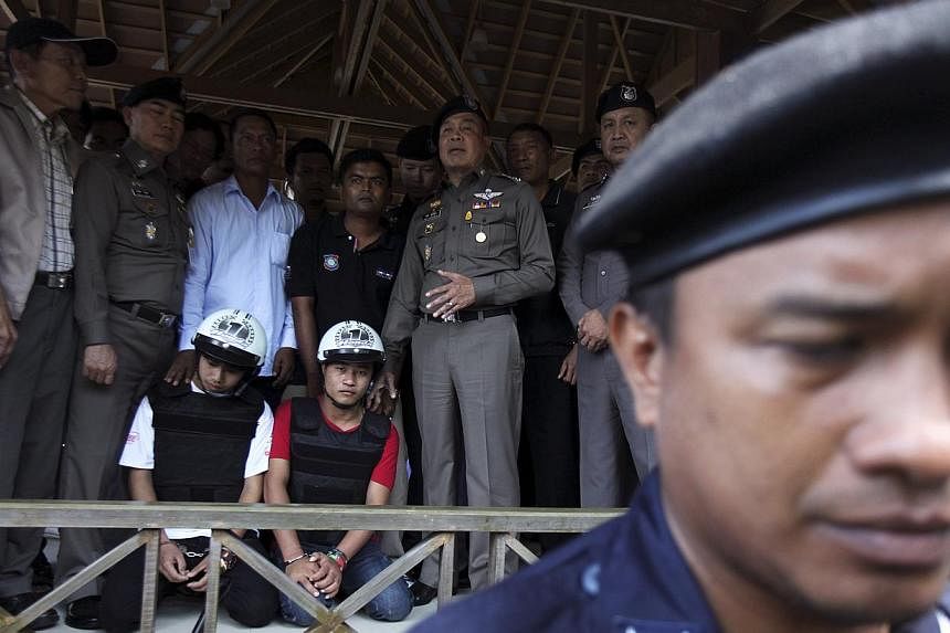 Myanmar has officially called for Thai authorities to reopen the investigation into the murder of two British tourists for which two Myanmar citizens have been arrested as there are "many unanswered questions". -- PHOTO: REUTERS