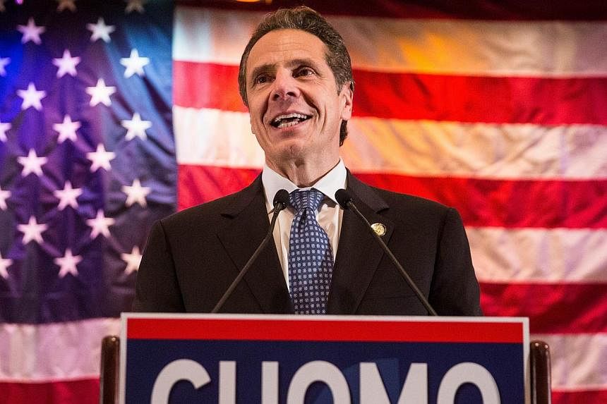 New York's Democratic Governor Andrew Cuomo has won re-election, CNN projected, defeating Republican Rob Astorino in the solidly Democratic state. -- PHOTO: AFP