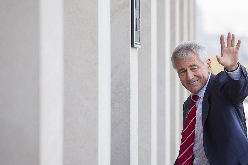 US Secretary of Defence Chuck Hagel arriving at the Pentagonon Nov 3, 2014 in Arlington, Virginia. Hagel has postponed a visit to Myanmar and Vietnam this month due to scheduling issues, including upcoming congressional hearings, a Pentagon official 