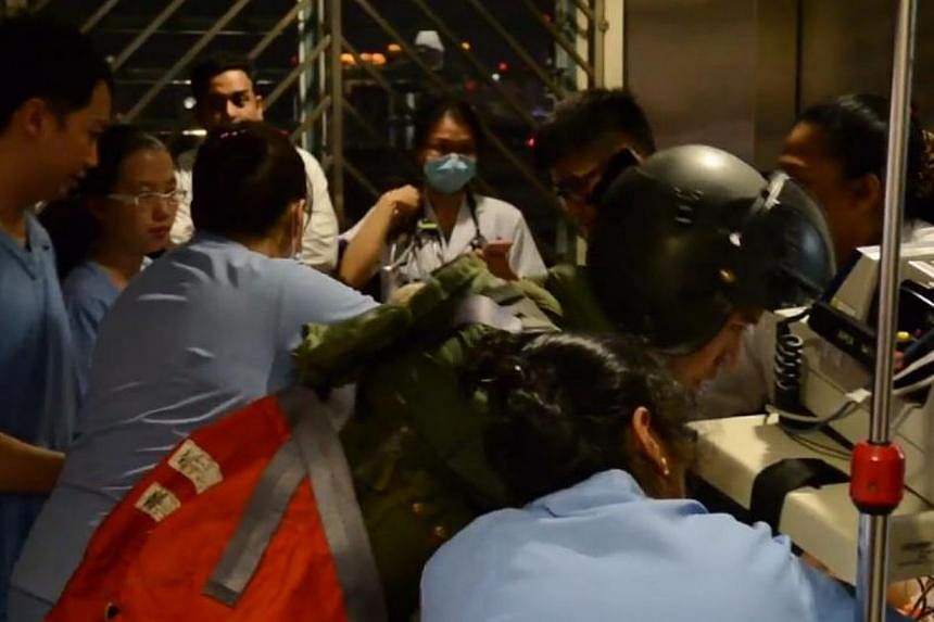 A member of the RSAF rescue team assisting medical staff at Tan Tock Seng Hospital. -- SCREENGRAB FROM FACEBOOK VIDEO