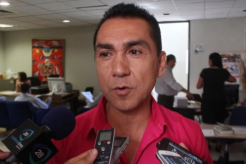 Fugitive former mayor Jose Luis Abarca speaks to the media in Chilpancingo in this October 29, 2013 file photo.&nbsp;Mexican police on Tuesday detained a fugitive former mayor and his wife accused of ordering a deadly police attack that left 43 stude
