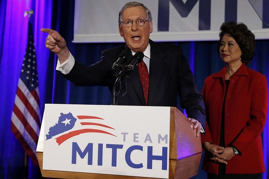 US Senate Minority Leader Mitch McConnell addresses supporters while accompanied by his wife, former United States Secretary of Labor Elaine Chao, at his midterm election night victory rally in Louisville, Kentucky, on Nov 4, 2014. -- PHOTO: REUTERS