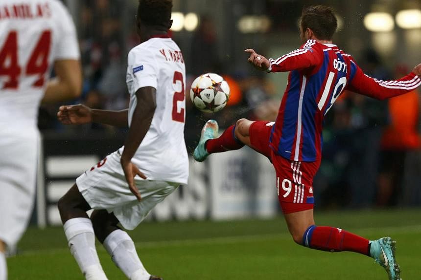 Bayern Munich's Mario Goetze (right) scores a goal against AS Roma during their Champions League Group E second leg match in Munich on Nov 5, 2014. -- PHOTO: REUTERS