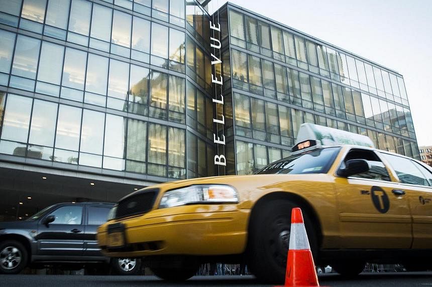 Traffic drives past Bellevue Hospital where Dr. Craig Spencer is currently recovering from Ebola in New York on Oct 27, 2014. -- PHOTO: REUTERS