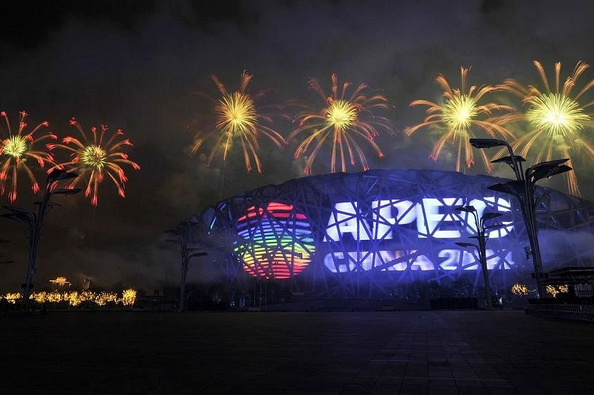 Fireworks explode over a screen displaying the APEC logo on the National Stadium, or the "Bird's Nest", during a rehearsal for the opening of the APEC Summit in Beijing on Nov 4, 2014.&nbsp;The Asia-Pacific Economic Cooperation (Apec) is a forum that