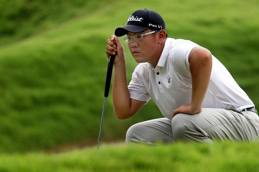 Singapore's golfer Choo Tze Huang comtemplates his shot during the second round of the Barclays Singapore Open held at the Sentosa Golf Club’s Serapong Course on Nov 9, 2012.&nbsp;Two bogeys in his closing three holes on Thursday did little to damp