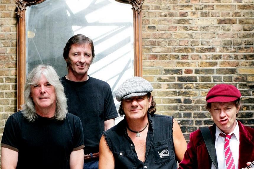AC/DC drummer Phil Rudd (second from left) is seen here in a group photo of the band.&nbsp;-- PHOTO:&nbsp;SONY BMG