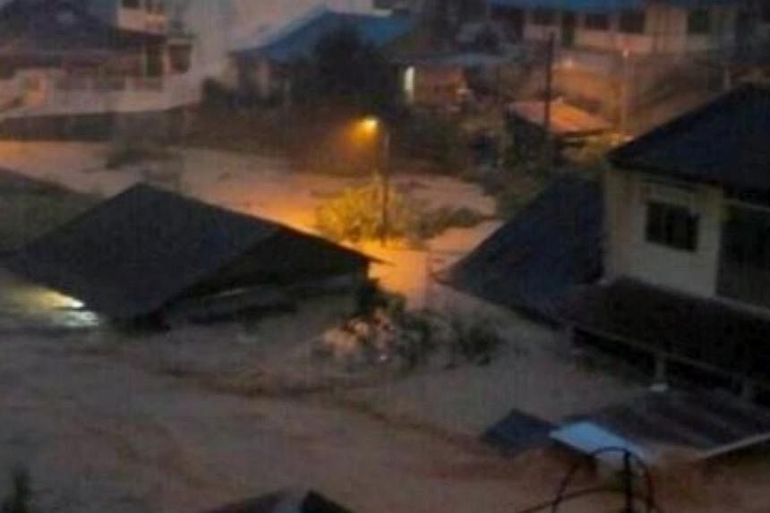 A picture making its rounds on Twitter showing flood waters almost reaching the roof of a low-level house.&nbsp;-- PHOTO: THE STAR/ASIA NEWS NETWORK