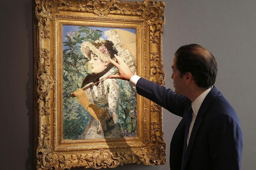 Adrien Meyer, international director at Christie's, shows the painting Le Printemps, 1881, by French painter Edouard Manet during its presentation at Christie's Auction House in Paris on Oct 22, 2014. -- PHOTO: REUTERS