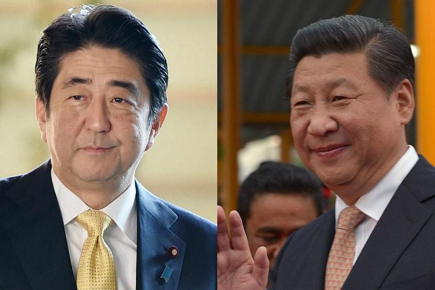 The Japanese and Chinese governments are making final arrangements for talks between Prime Minister Shinzo Abe (left) and Chinese President Xi Jinping (right), to be held on the sidelines of the upcoming Asia-Pacific Economic Cooperation forum in Bei