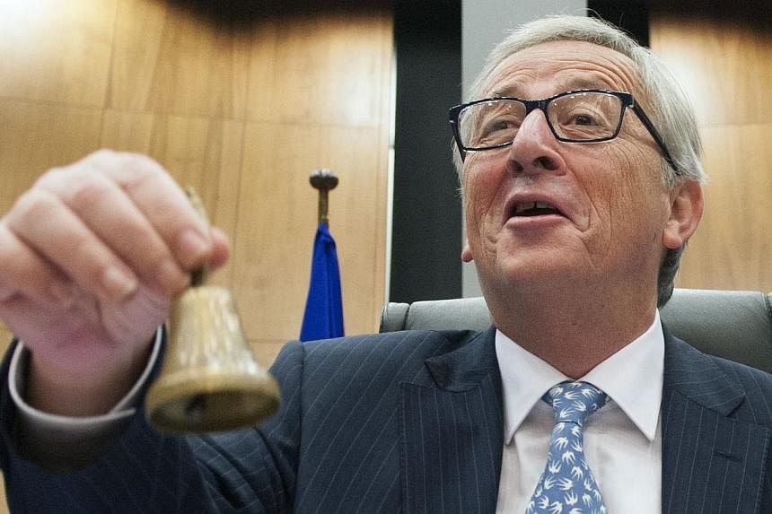 New European Commission chief Jean-Claude Juncker rings the bell on Nov 5, 2014 before the first meeting with commission colleagues in Brussels.&nbsp;Juncker stoked a bitter row between London and Brussels on Wednesday, accusing Prime Minister David 