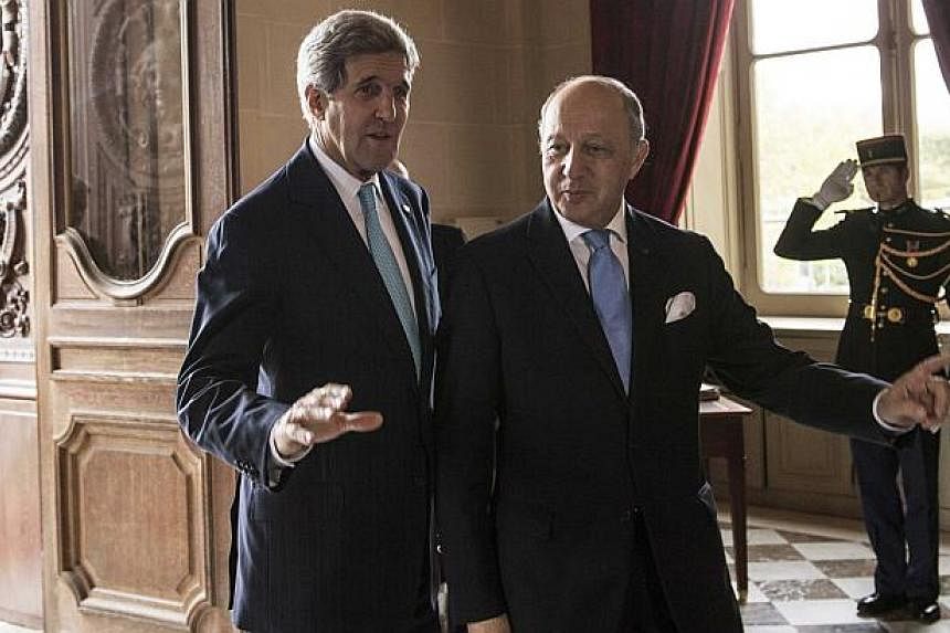 US Secretary of State John Kerry (left) meets French Foreign Minister Laurent Fabius at the Quai d'Orsay in Paris Nov 5, 2014. Kerry claimed on Wednesday he was "driving towards the finish" to secure what would be a historic deal with Iran over its n